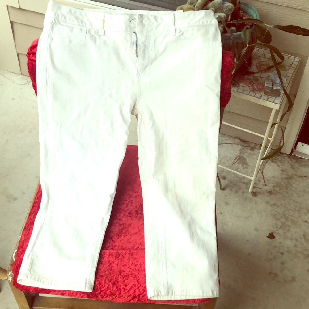 Distressed white jeans with a hint of purple